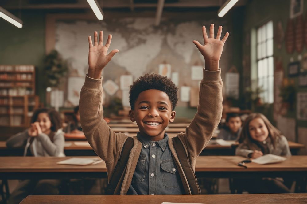 A happy african american boy raises his hand classroom portrait student. AI generated Image by rawpixel.