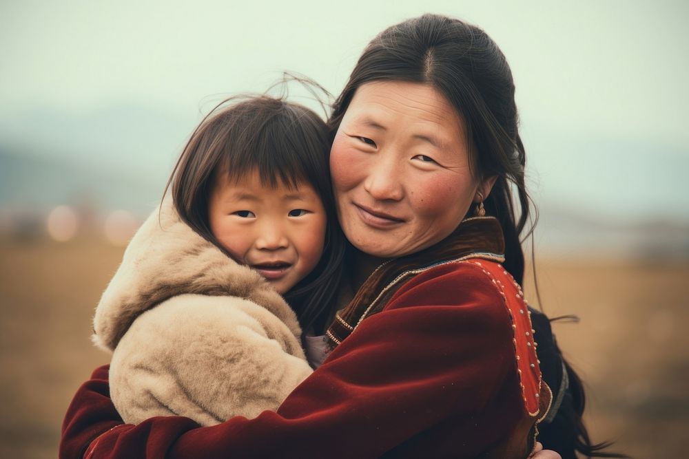 Mongolian woman holding and daughter hugging cheep in the style lomo filter family adult photo. AI generated Image by…