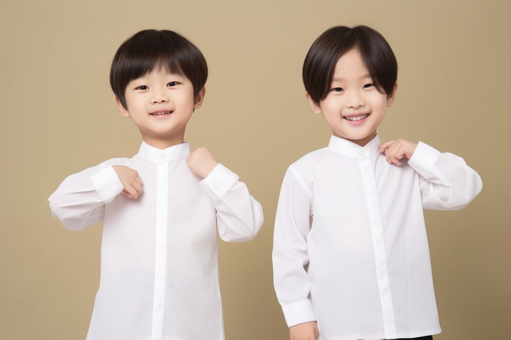 Two asian kids dresses blank white mandarin collar shirt portrait happy photo. AI generated Image by rawpixel.