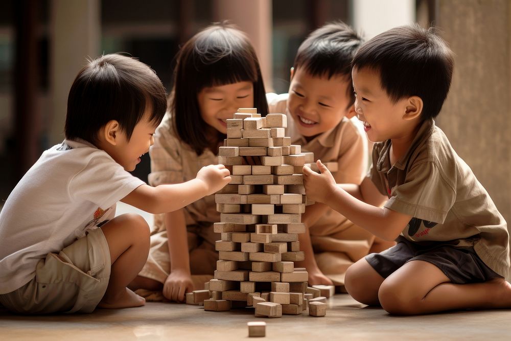 Asian kids building blocks child togetherness friendship. AI generated Image by rawpixel.