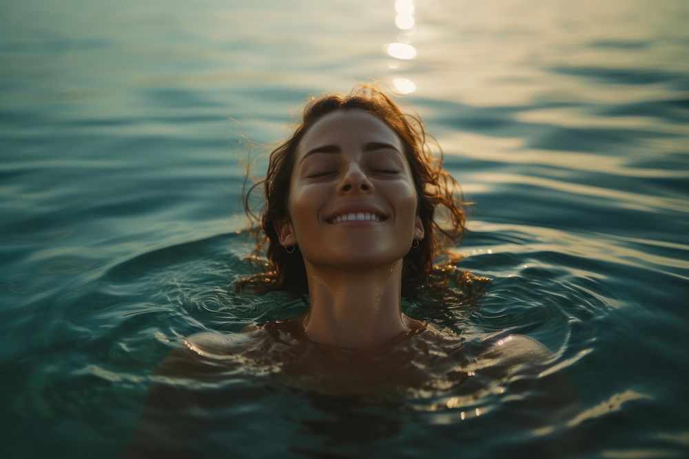 Relaxed woman enjoying the sea swimming portrait outdoors. AI generated Image by rawpixel.