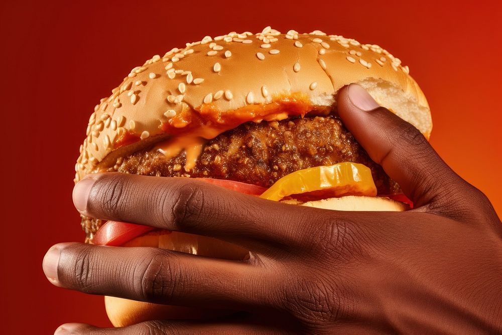 Hand holding burger food red hamburger. AI generated Image by rawpixel.