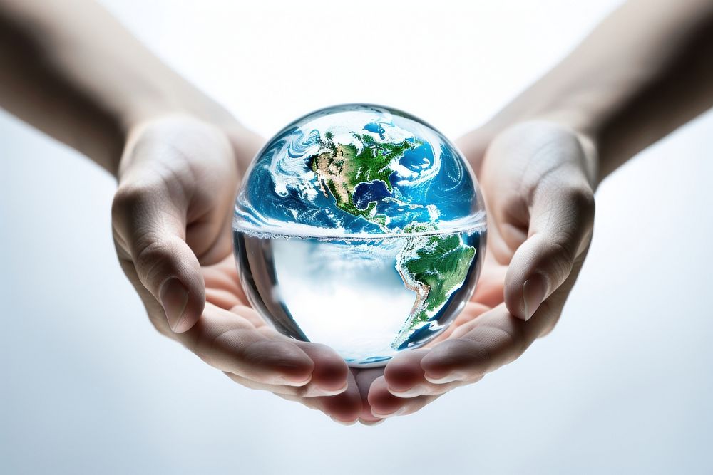 Holding earth made of crystal clear water droplet sphere planet globe. AI generated Image by rawpixel.