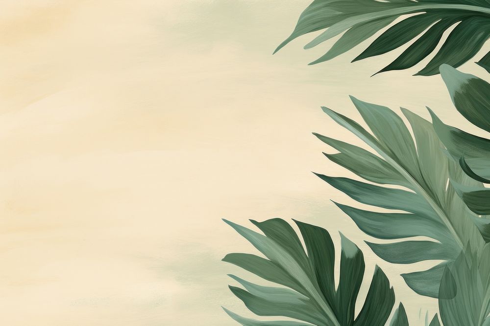 Tropical leaves border green backgrounds outdoors. 