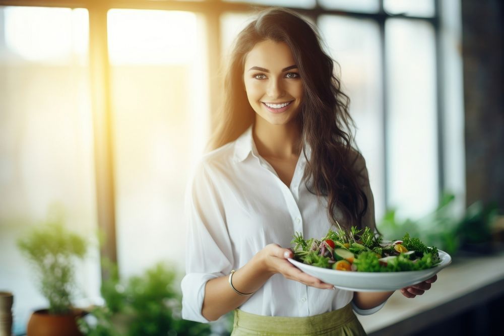 A beautiful girl eating salad adult smile plant. AI generated Image by rawpixel.