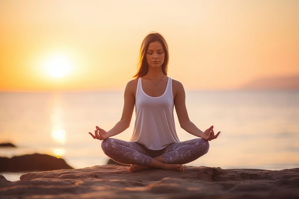 A Caucasian woman practicing yoga at seashore sports adult contemplation. AI generated Image by rawpixel.