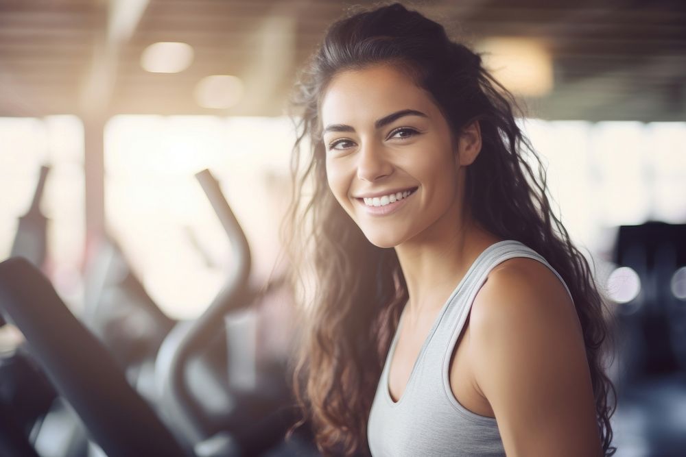 A Woman exercising in fitness gym for good health smile adult happy. AI generated Image by rawpixel.