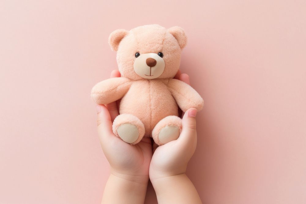 Baby hands holding teddy bear doll toy representation relaxation. AI generated Image by rawpixel.