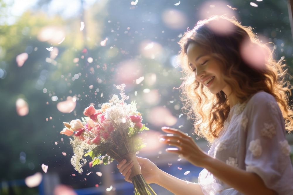 A bride going to throw the flower bouqet for women guests in wedding ceremony defocused portrait outdoors. AI generated…