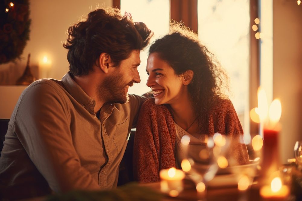 Happy couple sitting at the table and celebrating holiday candle adult happy. AI generated Image by rawpixel.