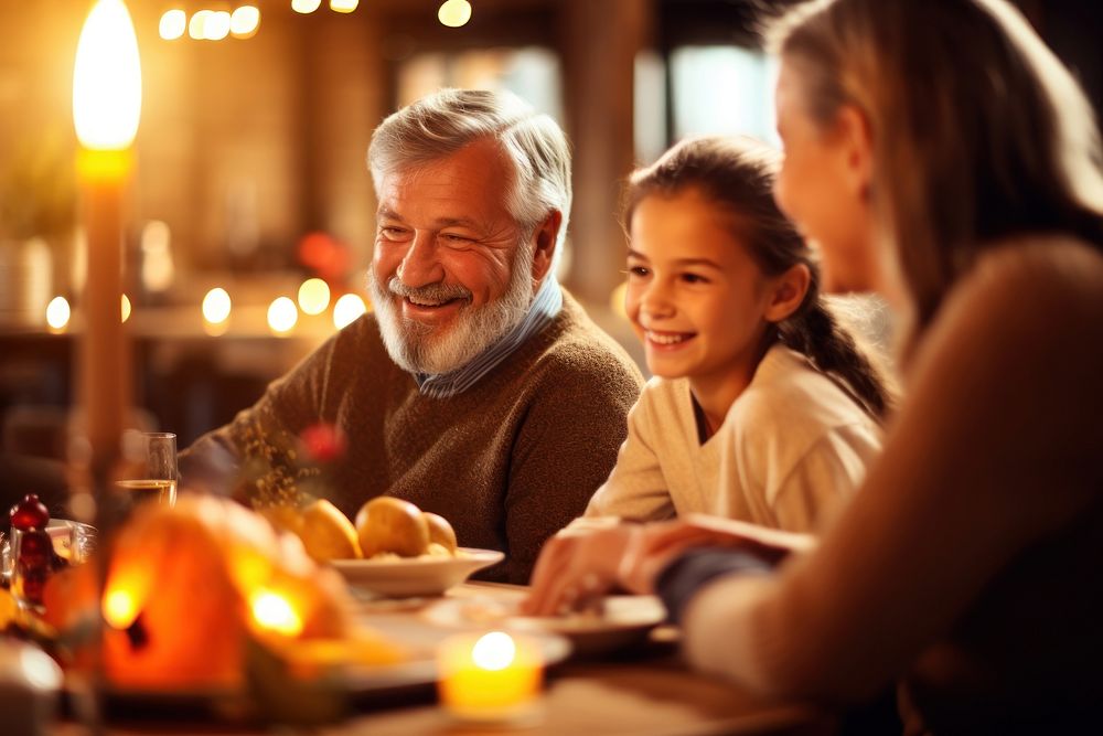 Happy family sitting at the table and celebrating holiday grandchild dinner candle. AI generated Image by rawpixel.