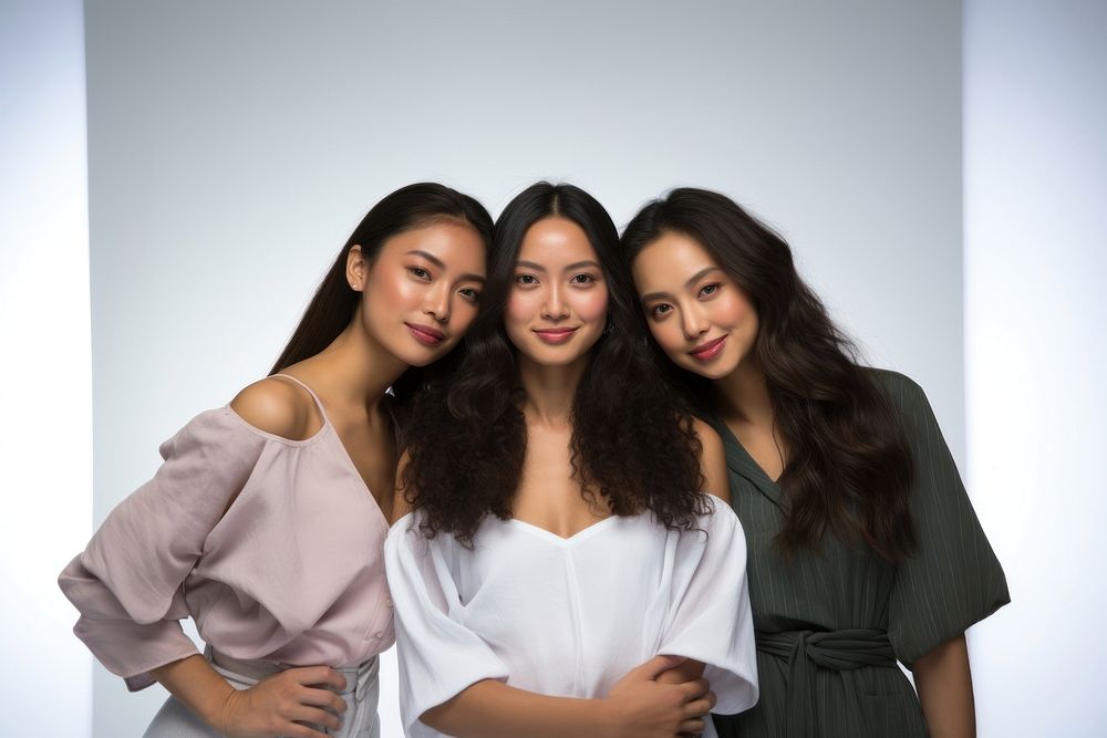 4 Millennial women looking at the camera with confidence standing adult dress. AI generated Image by rawpixel.