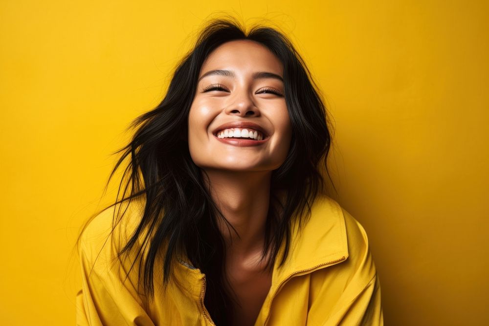 Asian woman laughing smiling yellow. AI generated Image by rawpixel.