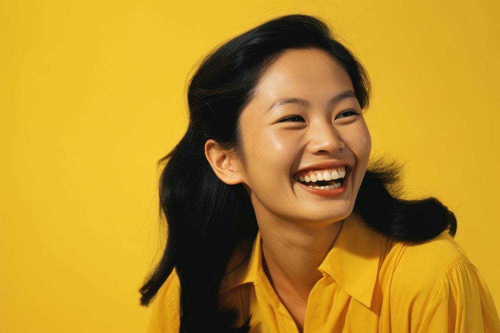 Asian woman laughing smiling yellow. AI generated Image by rawpixel.