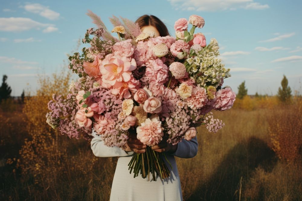 Person holding bouquet flower outdoors portrait. AI generated Image by rawpixel.