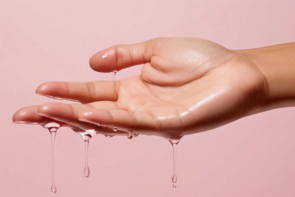 Woman hand finger drop pink. AI generated Image by rawpixel.