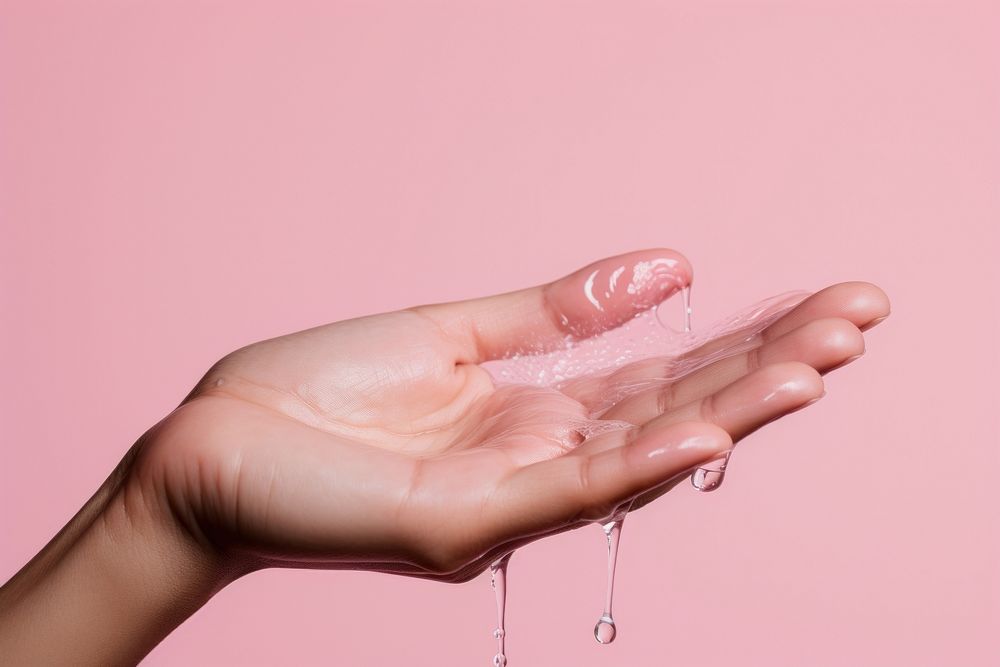 Woman hand finger pink drop. AI generated Image by rawpixel.