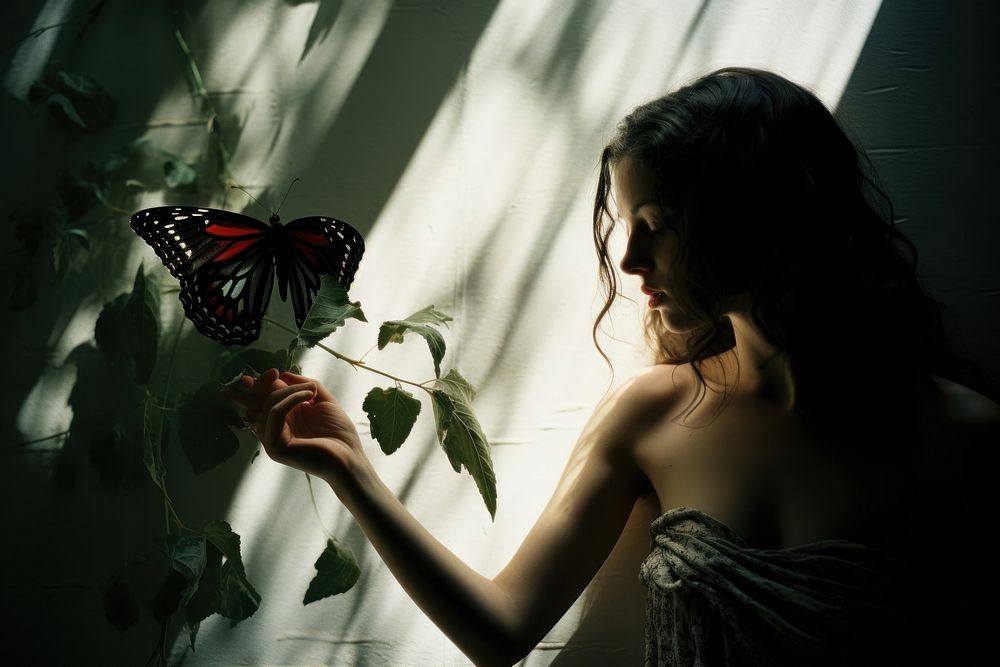 A woman and a butterfly hand photography portrait. AI generated Image by rawpixel.