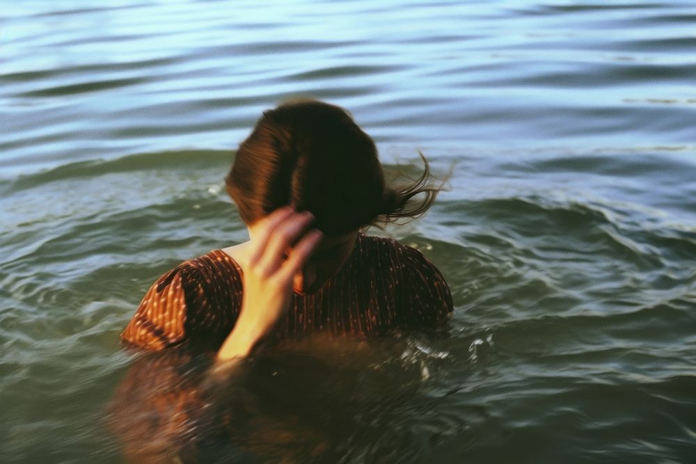 A woman in the river swimming outdoors nature. AI generated Image by rawpixel.