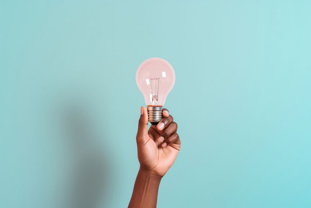 Hand hold light bulb lightbulb electricity illuminated. AI generated Image by rawpixel.