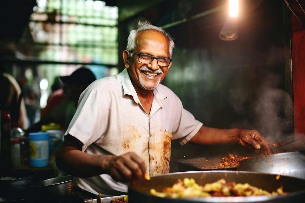 Indian elderly cooking south asian food glasses adult. AI generated Image by rawpixel.