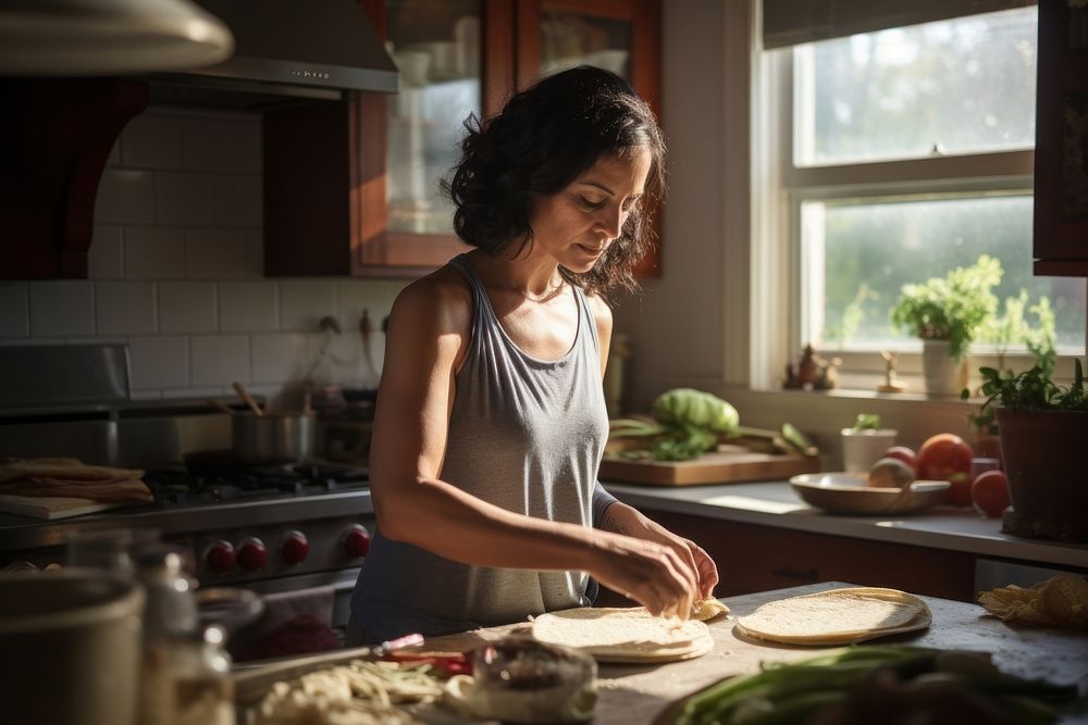 Hispanic 45 year-old mother food cooking kitchen. AI generated Image by rawpixel.