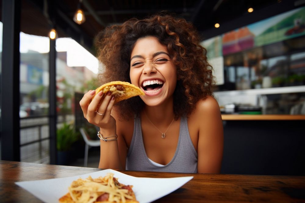 Mexican lady happy eating food biting. AI generated Image by rawpixel.