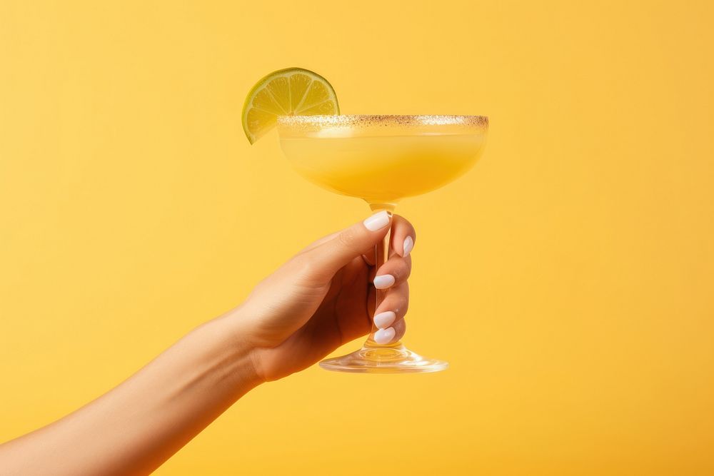 Hand taking a cocktail glass drink margarita alcohol. AI generated Image by rawpixel.