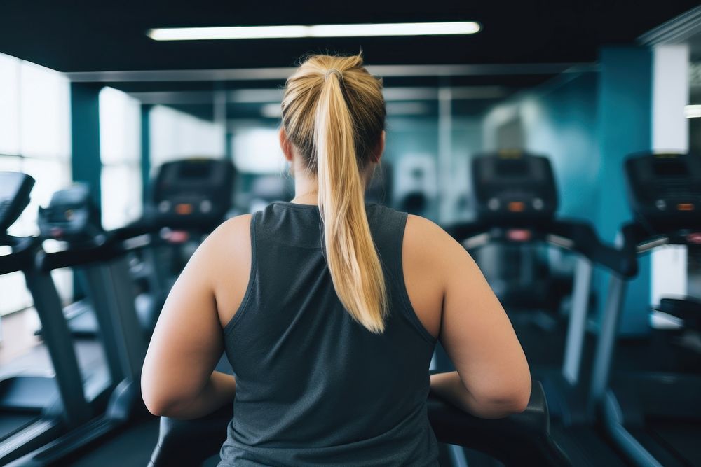 Woman in modern gym exercising treadmill fitness sports. AI generated Image by rawpixel.