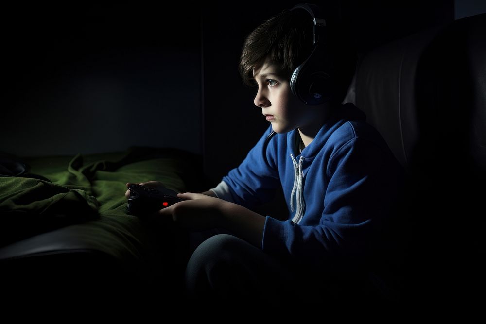 Kid playing video games photography headphones portrait. AI generated Image by rawpixel.