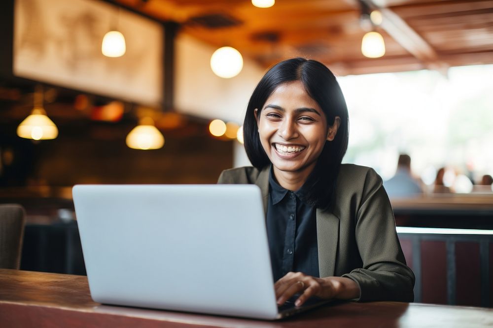 Indian woman smiling laptop adult computer. AI generated Image by rawpixel.