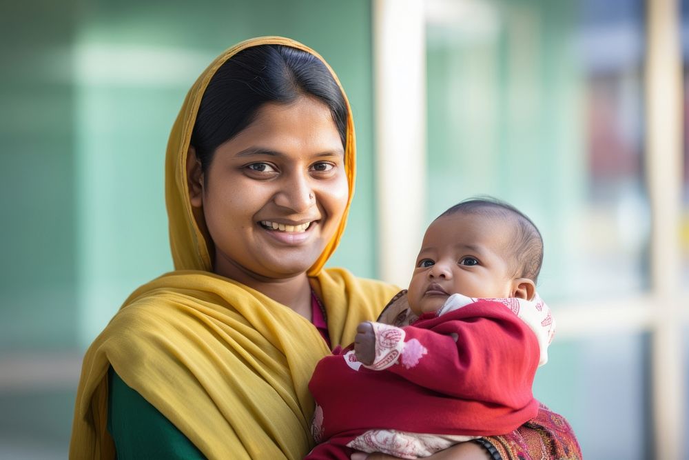 Indian woman smiling baby portrait holding. AI generated Image by rawpixel.