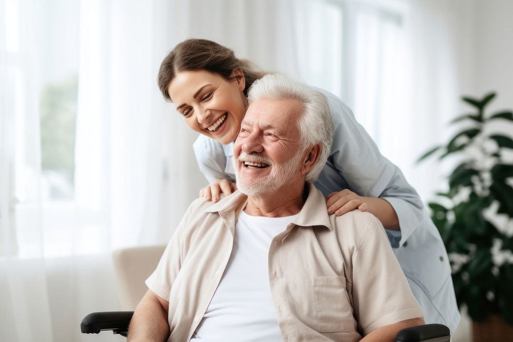 Caring female doctor embracing helping happy senior male disabled patient smiling adult care. AI generated Image by rawpixel.