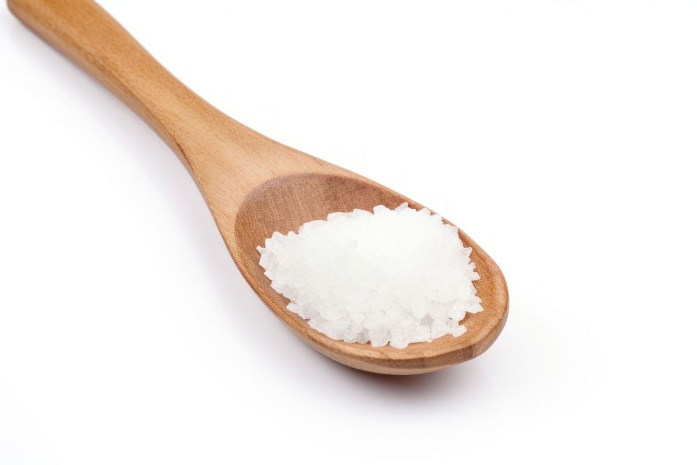 Salt in wooden spoon white white background seasoning. AI generated Image by rawpixel.