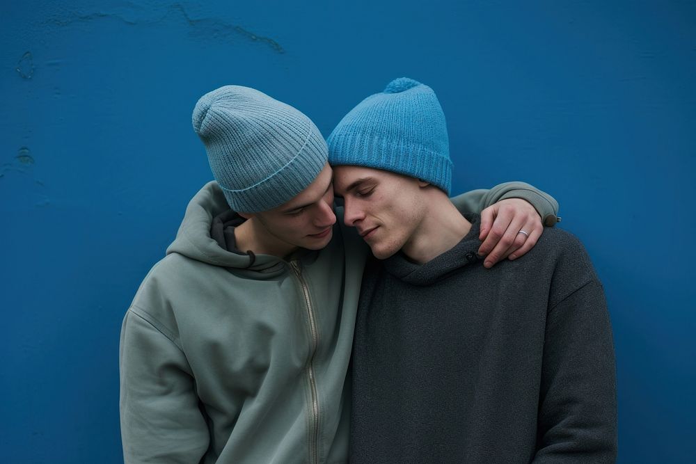 Friends embracing standing beanie. AI generated Image by rawpixel.
