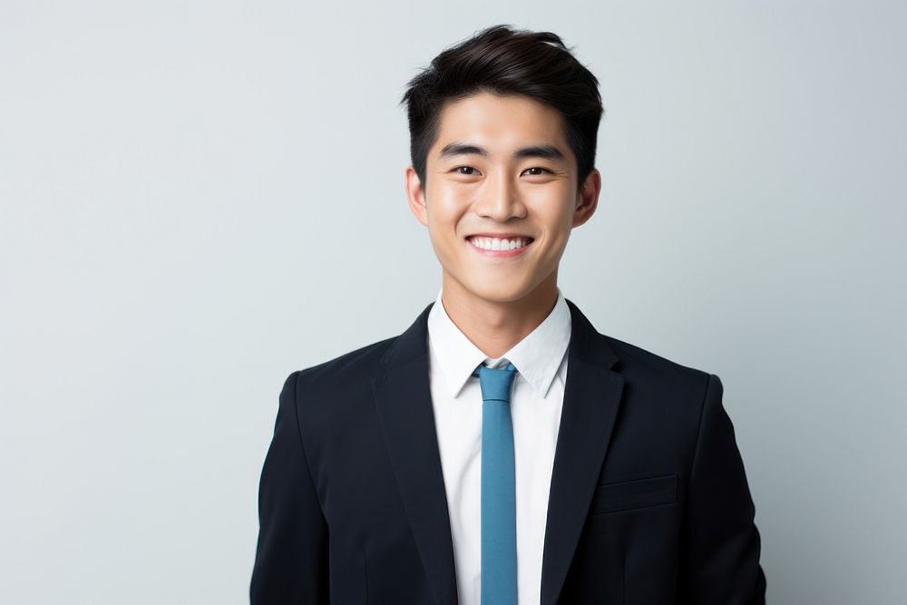 Young Asian businessman smiling portrait adult smile. AI generated Image by rawpixel.