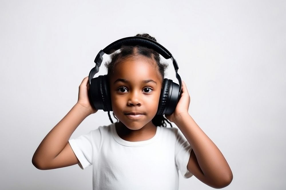 Black little girl headphones listening portrait. AI generated Image by rawpixel.