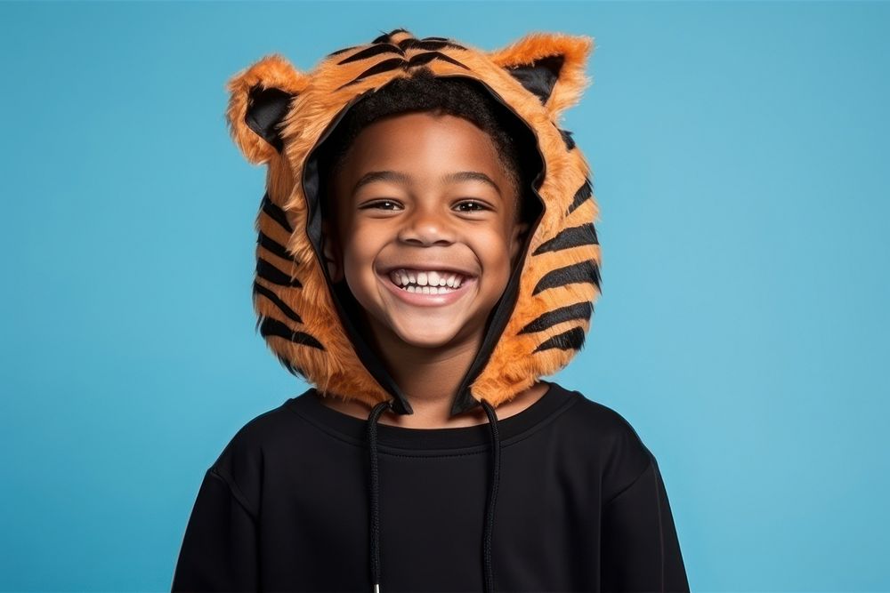 Black young boy smile tiger cute. AI generated Image by rawpixel.