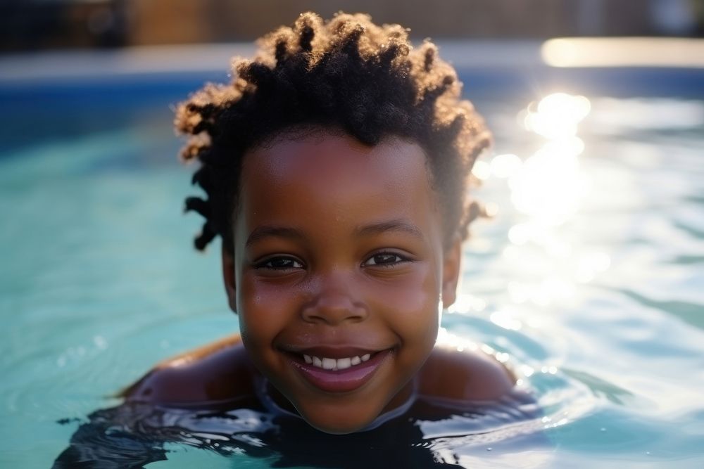 Black kid swimming smiling bathing. AI generated Image by rawpixel.