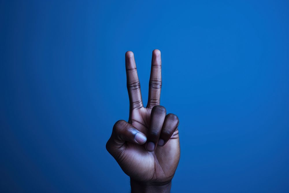 Empowering Voices finger hand blue. AI generated Image by rawpixel.