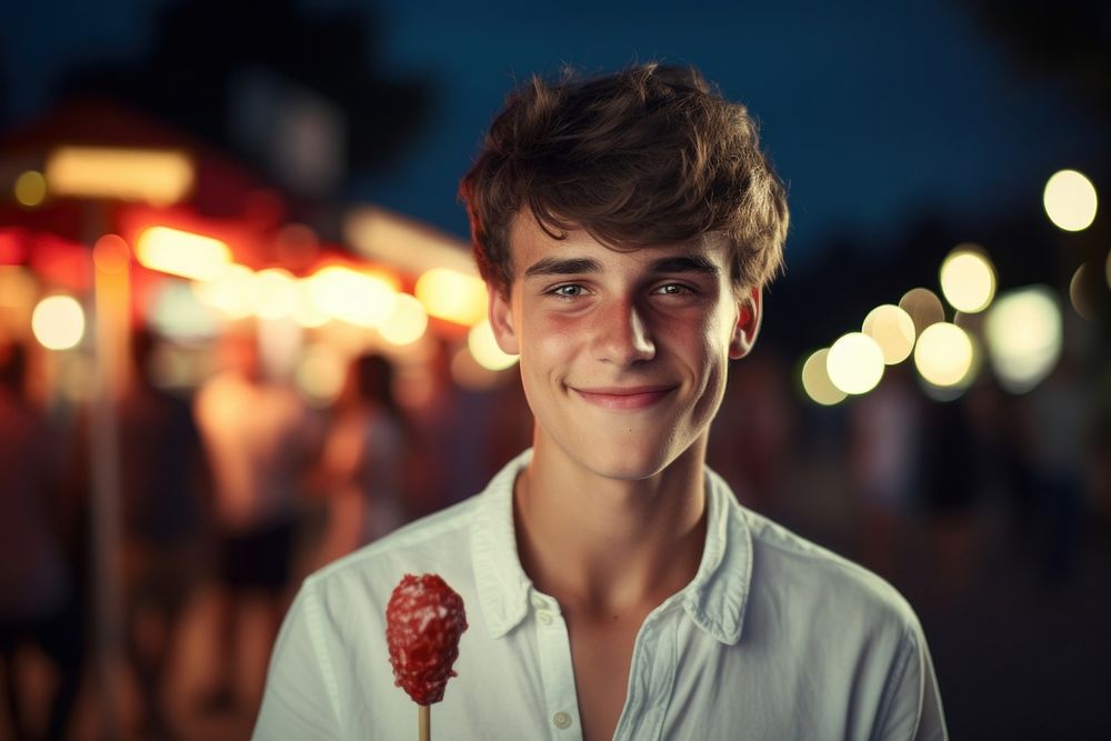 Young man eating ice lolly portrait adult smile. AI generated Image by rawpixel.