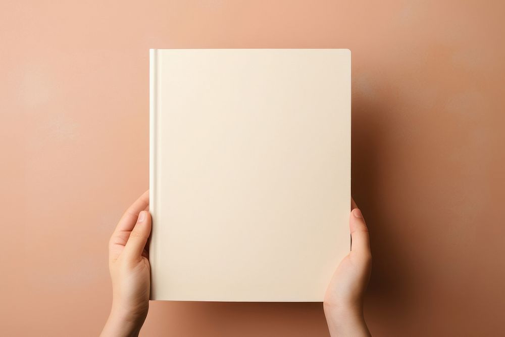 Hand holding blank book publication page simplicity. AI generated Image by rawpixel.