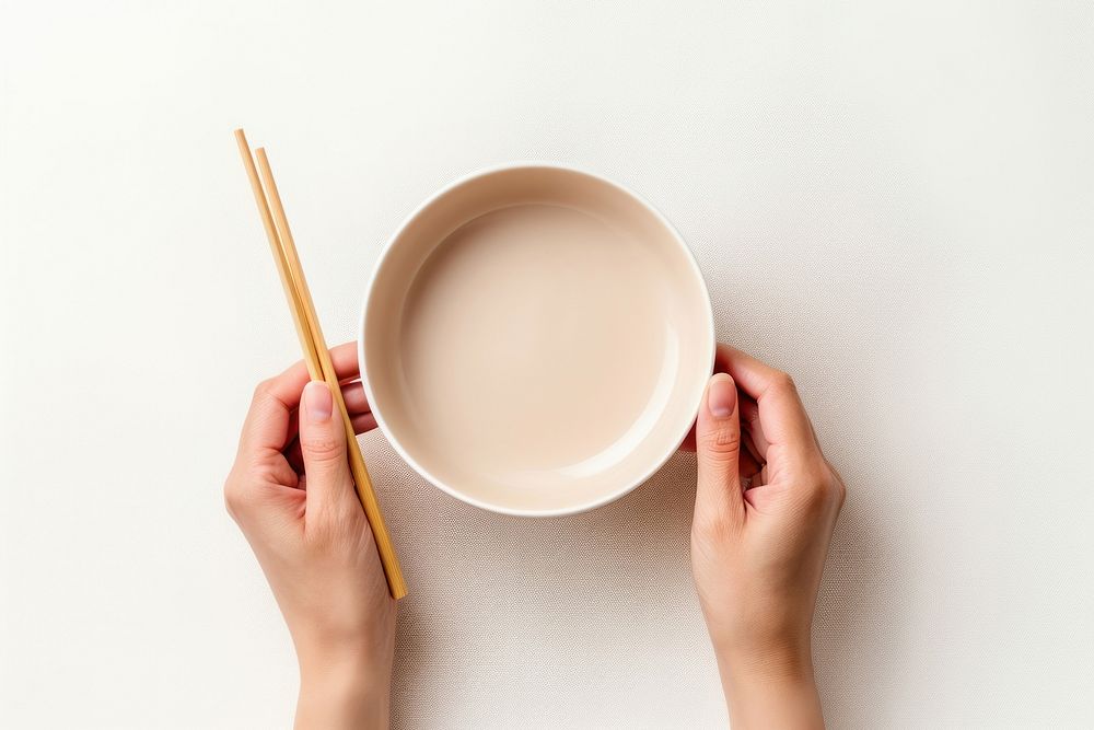 Hands hoding chopsticks with bowl food tableware crockery. AI generated Image by rawpixel.
