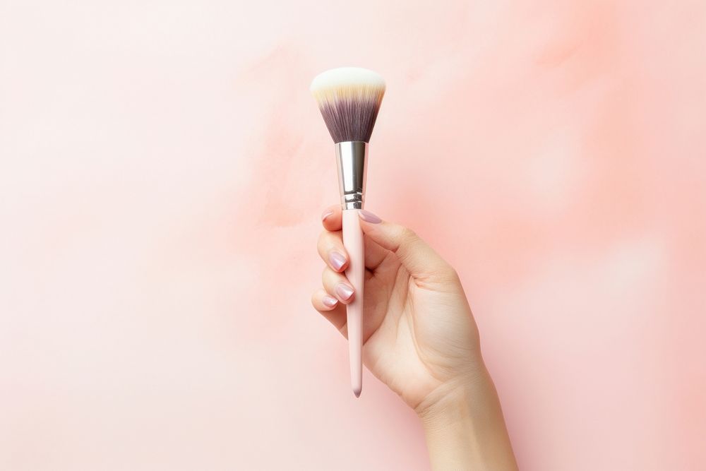 Hands holding brush on and cosmetic brush cosmetics tool paintbrush. AI generated Image by rawpixel.