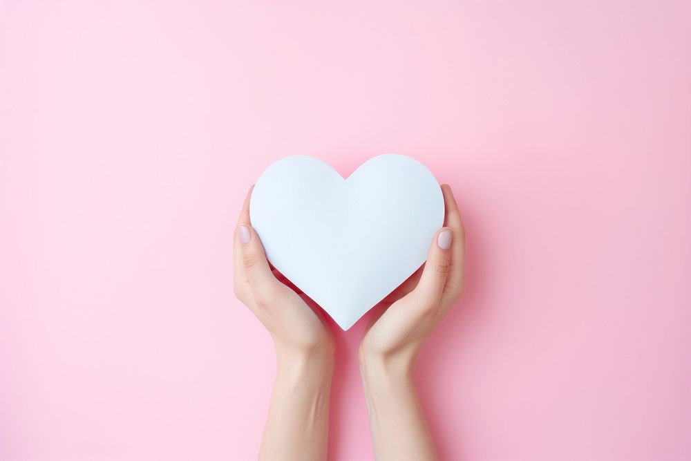 Hands holding pink heart paper adult celebration romance. AI generated Image by rawpixel.