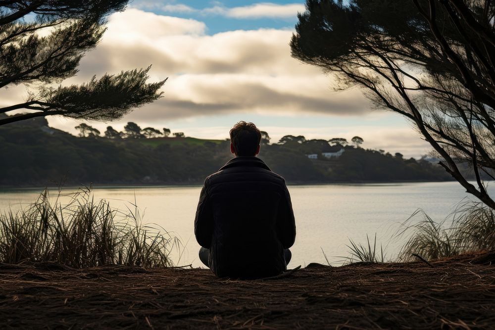 Man with black sweater sitting land silhouette. AI generated Image by rawpixel.