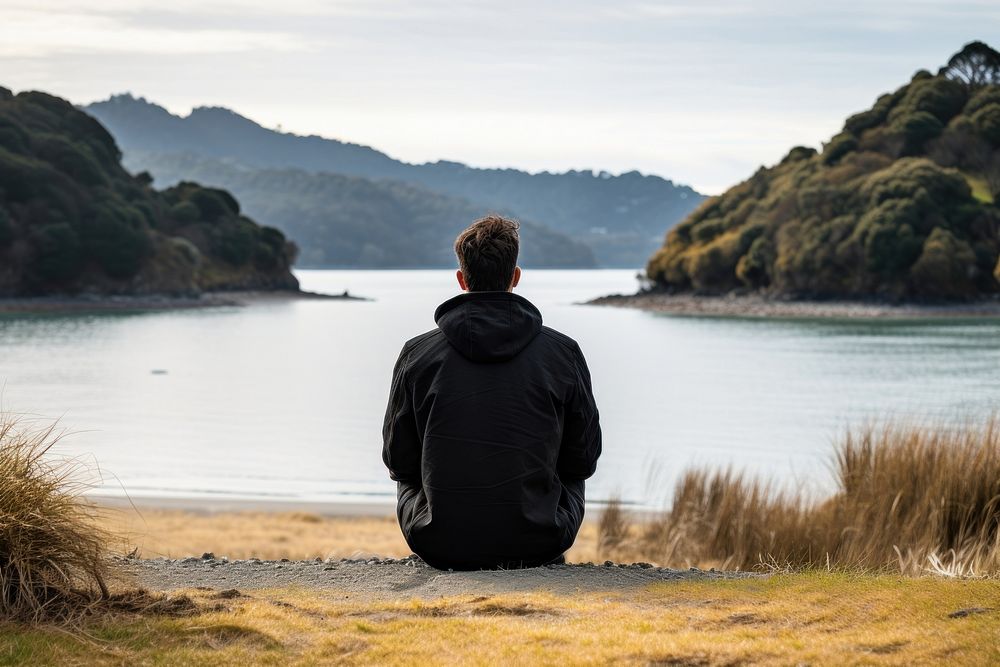 Man with black sweater sitting outdoors nature. AI generated Image by rawpixel.
