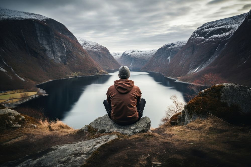 Norewegian man sitting landscape mountain. AI generated Image by rawpixel.