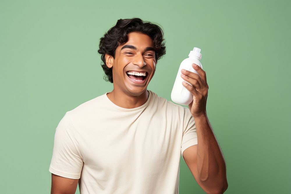 North indian man laughing smiling holding. AI generated Image by rawpixel.