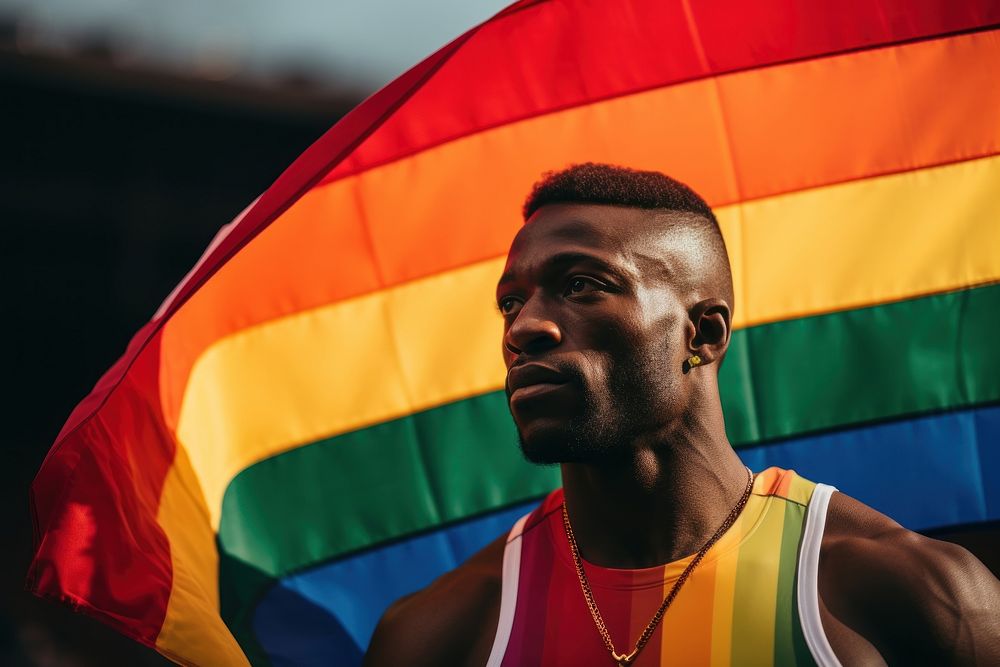 Athlete holding rainbow flag adult man accessories. AI generated Image by rawpixel.